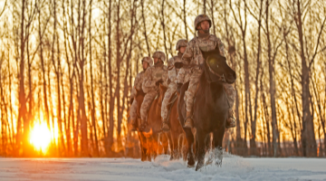 Border defense troops patrol on horseback