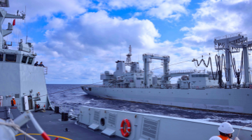 Naval vessels conduct replenishment-at-sea