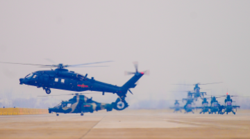 Multi-type army helicopters lift off for training