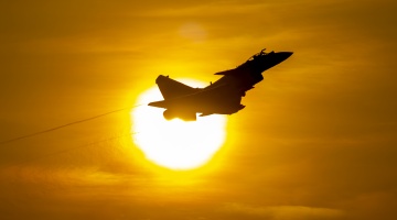 Fighter jets take off at twilight