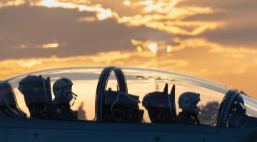 Pilot checks avionics system before takeoff