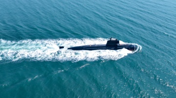 Submarine steams towards designated area