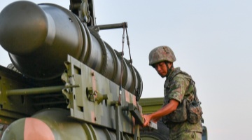 Anti-aircraft guns fire at target drone