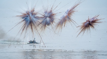 Amphibious assault vehicle fires at sea