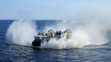 Landing craft air cushion steers into well deck