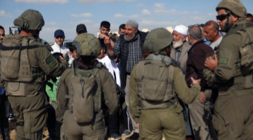 Israeli soldiers prevent Palestinians from accessing their lands in Hebron