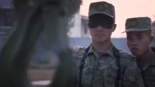 Blindfolded missile loader ignites matches with crane hook