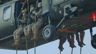 Soldiers practice fast-roping with helicopters