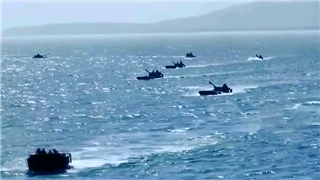 Amphibious vehicles dash to beachhead