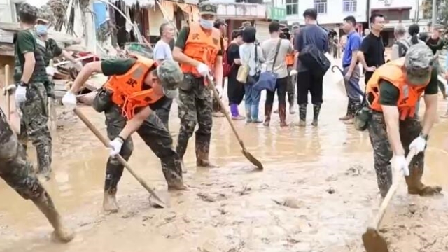 PAP troops, militias keep fighting on frontline of flood control, disaster relief