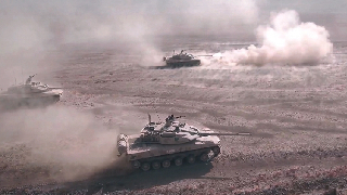 Tanks Send Up Clouds of Dust