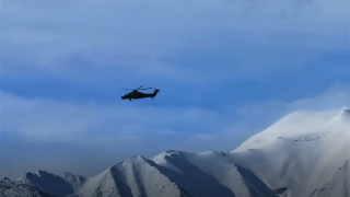 Choppers Fly in Mountain Area 