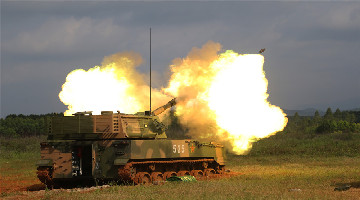 Self-propelled howitzers in live-fire training