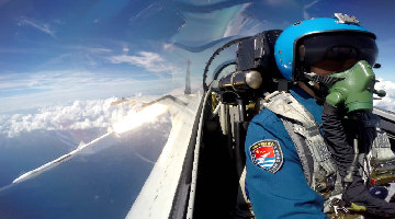 J-11 fighter jets conduct live-fire training in South China Sea