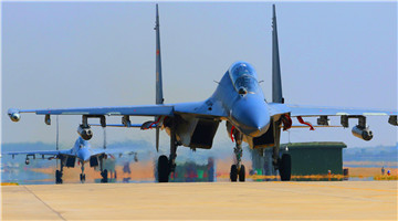 J-11 fighter jets fire rocket launchers