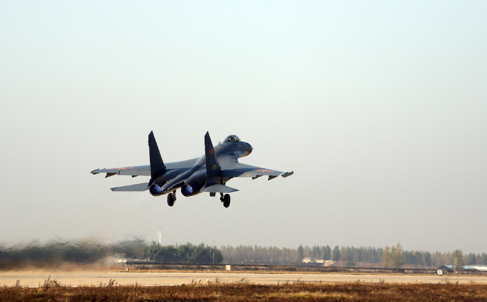 A J-11B fighter jet attached to an aviation regiment of the air force under the PLA Northern Theater Command takes off for a sortie during a flight training exercise on Oct. 25, to beef up pilots' all-weather combat capabilities. (81.cn/ Wang Meng) A J-11B fighter jet attached to an aviation regiment of the air force under the PLA Northern Theater Command takes off for a sortie during a flight training exercise on Oct. 25, to beef up pilots' all-weather combat capabilities. (81.cn/ Wang Meng)