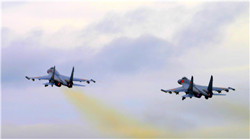 J-11 fighter jets in formation flight training