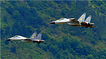 J-11 fighter jets fly through valley