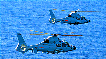 Z-9 helicopters fire missiles over South China Sea