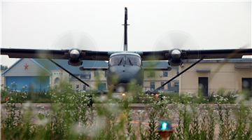 Y-12 transport aircraft takes off at night