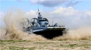 LCAC blows up sand as it lands on beach