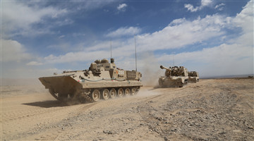 Armored vehicle convoy maneuver in desert