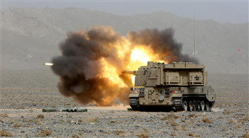 Gun-howitzer system spits fire