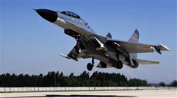 J-11 fighter jets taxi down the runway