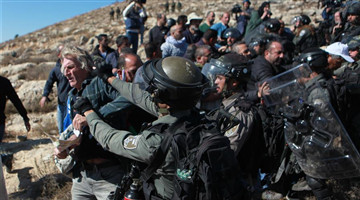 Israeli soldiers detain Palestinian protester in West Bank village near Hebron