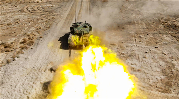 Tanks fire main guns at mock targets