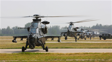 Attack helicopters prepare to lift off