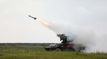 Missile launching vehicle in live-fire test