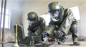 Chemical defense troops take samples from scenario affected area