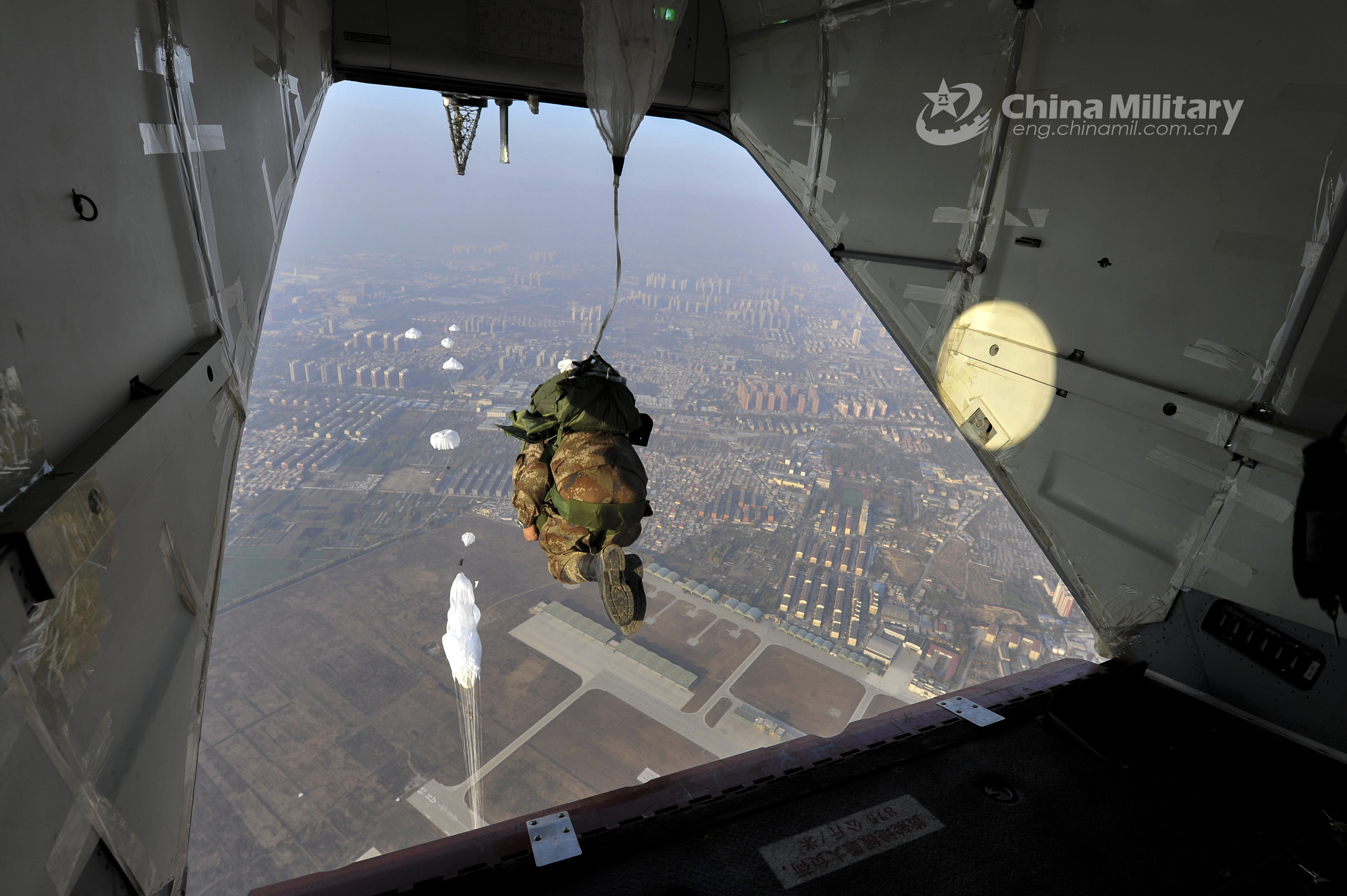 Paratroopers descend to the ground during training exercise China