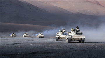 Armored vehicles march in Gobi desert