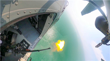 Attack helicopters engage in live-fire training