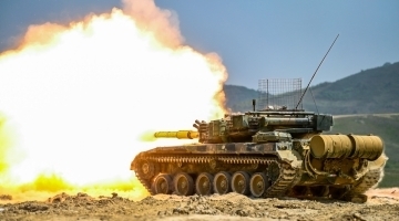 Tanks fire at mock targets during live-fire training exercise