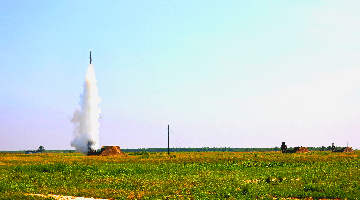 Air-defense missile systems fire in round-the-clock training