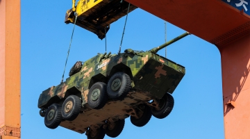 Armored troops practice load and upload of vehicles