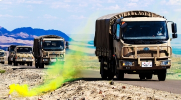 Military vehicles in long-distance maneuver