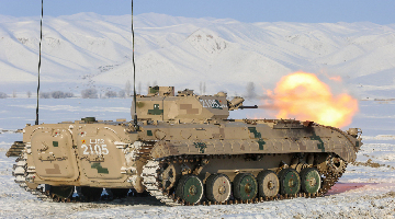 Armored vehicles train in snow