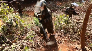 Army soldiers dispose of unexploded ordnance in border area