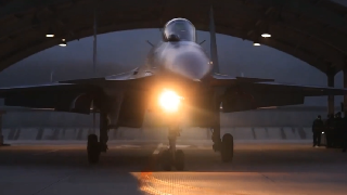 J-15 carrier-borne fighter jet in day-and-night flight training