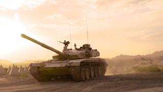 Battle vehicles march in desert